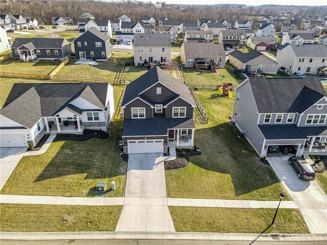 birds eye view of property with a residential view