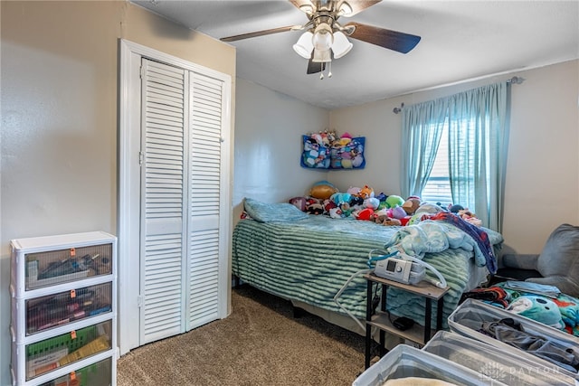 carpeted bedroom featuring a ceiling fan and a closet