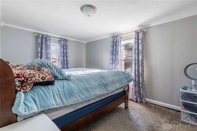 bedroom with baseboards, ornamental molding, a textured ceiling, carpet flooring, and a textured wall