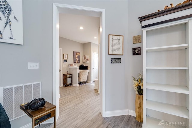 corridor with recessed lighting, wood finished floors, visible vents, and baseboards