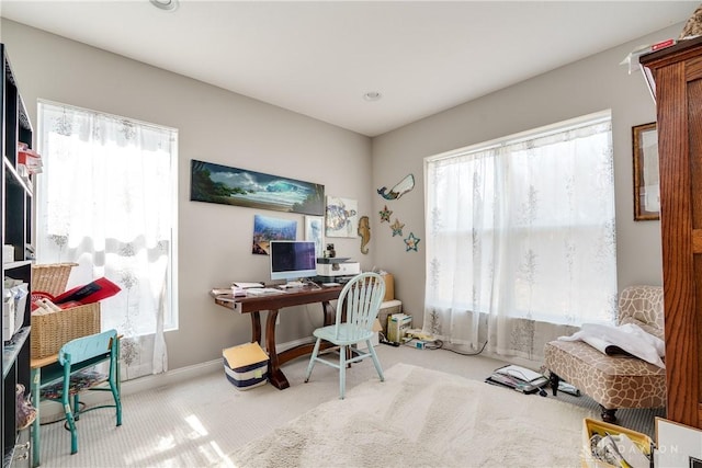 home office featuring baseboards and carpet floors