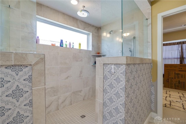 bathroom featuring a walk in shower and a textured ceiling