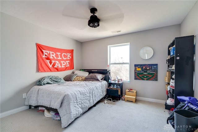 bedroom featuring visible vents, carpet floors, baseboards, and ceiling fan