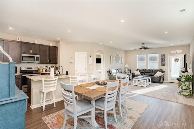 dining space with visible vents, recessed lighting, and wood finished floors