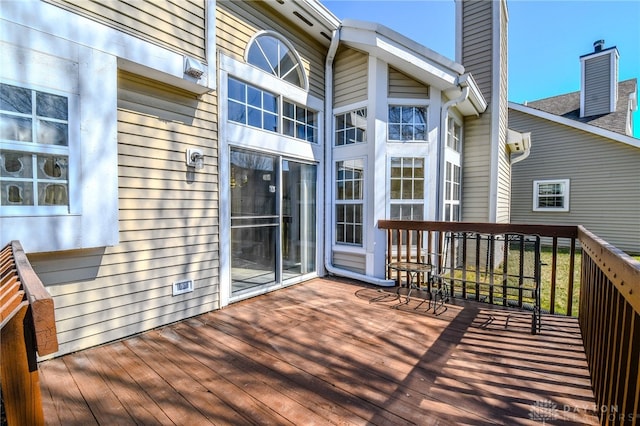 deck with a wall mounted AC