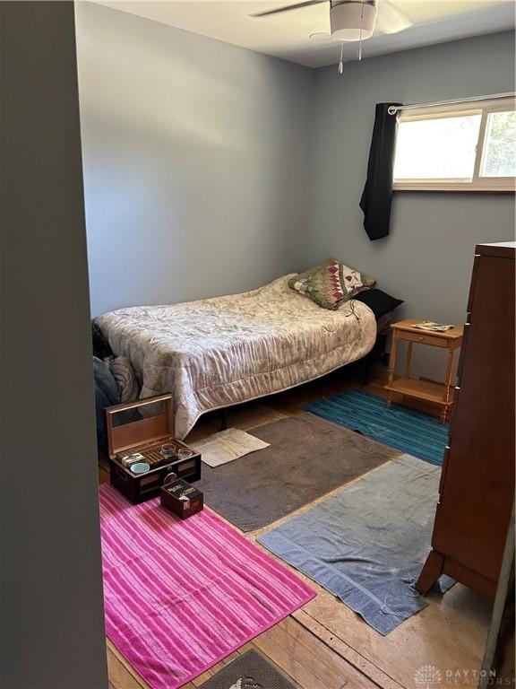 bedroom with wood finished floors and a ceiling fan