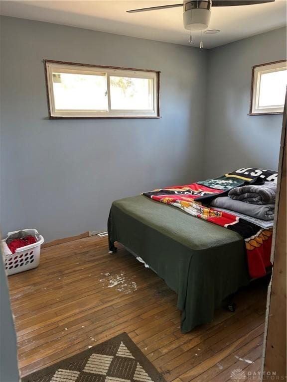 bedroom with wood-type flooring and ceiling fan