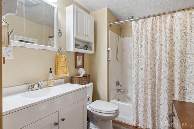 bathroom with vanity, a textured ceiling, toilet, and shower / bath combination with curtain