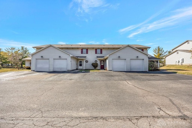 traditional-style home with driveway and an attached garage