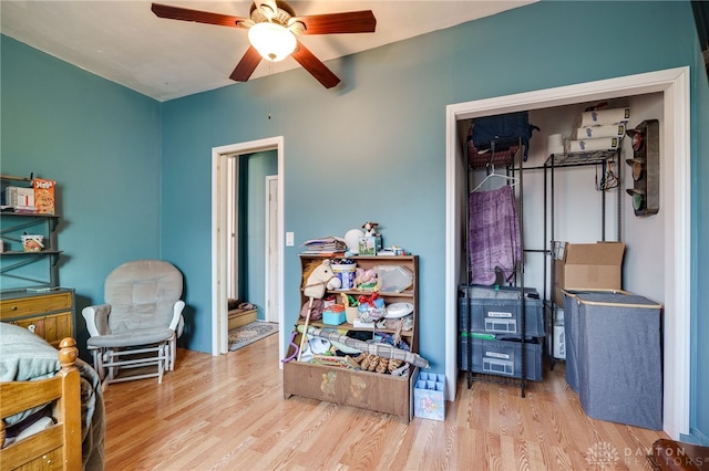 bedroom featuring ceiling fan and wood finished floors