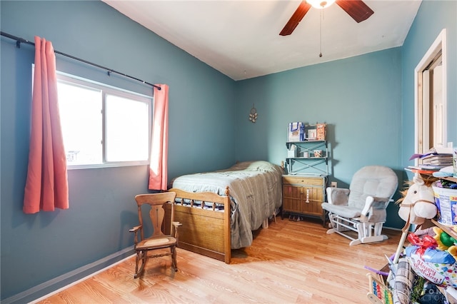 bedroom featuring ceiling fan and wood finished floors