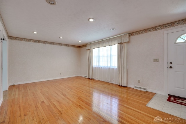 entryway featuring recessed lighting, visible vents, baseboards, and light wood-style floors