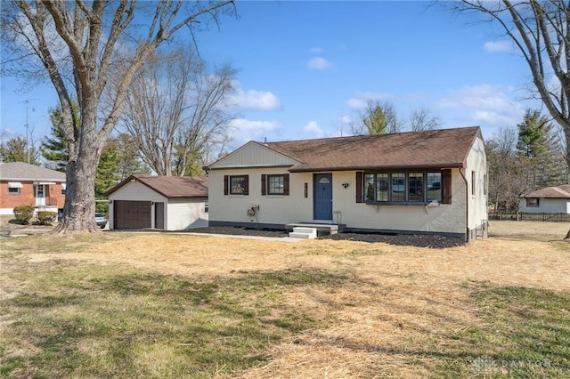 single story home featuring a garage, brick siding, an outdoor structure, and a front yard