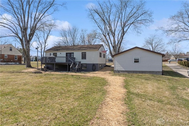 back of property featuring stairs, a lawn, and a wooden deck