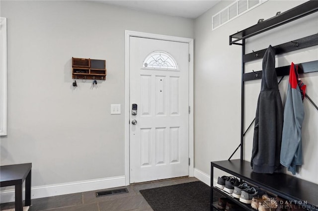 entryway with visible vents and baseboards