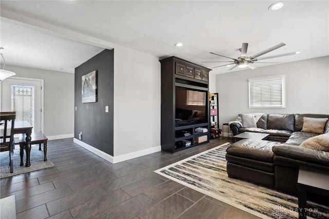 living area featuring recessed lighting, baseboards, and ceiling fan