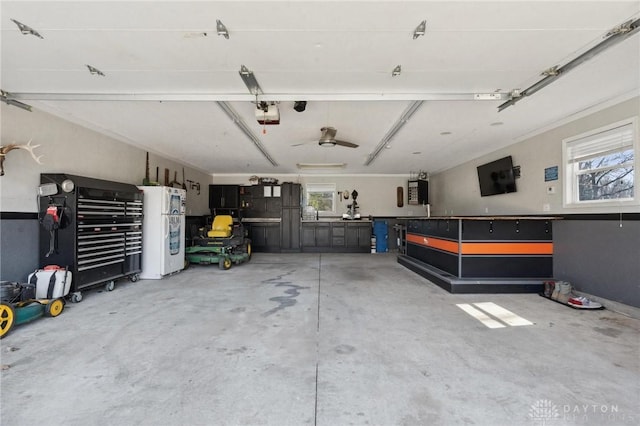 garage featuring a garage door opener and freestanding refrigerator