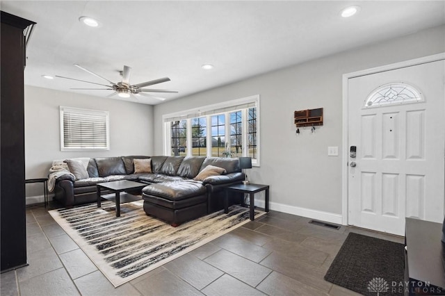 living area featuring recessed lighting, visible vents, baseboards, and a ceiling fan