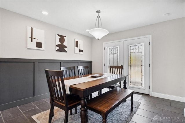 dining room featuring recessed lighting and baseboards