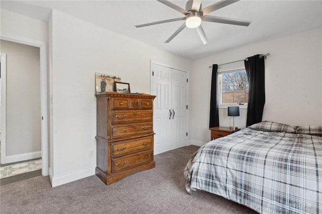 bedroom featuring a closet, ceiling fan, baseboards, and carpet floors