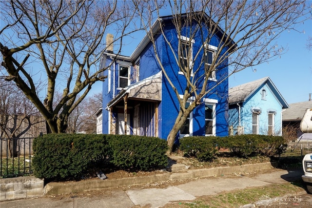 view of front of house with fence