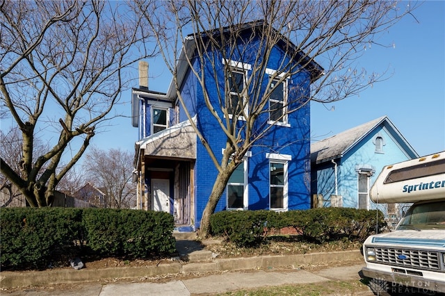 view of front of home with a chimney