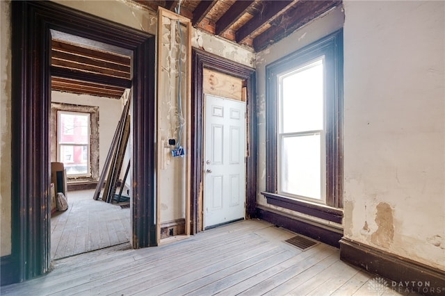 interior space with visible vents and hardwood / wood-style floors