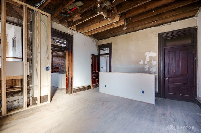 spare room featuring wood finished floors