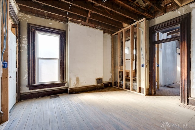 misc room featuring visible vents and hardwood / wood-style flooring