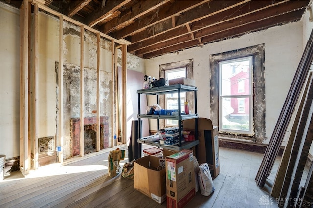 miscellaneous room featuring visible vents and hardwood / wood-style floors