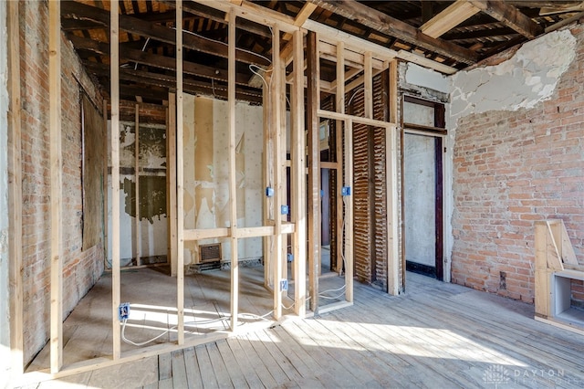 miscellaneous room featuring brick wall