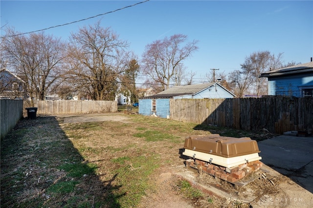 view of yard with a fenced backyard