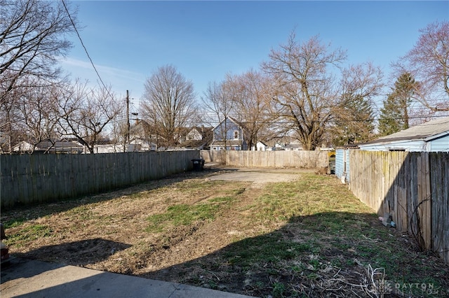 view of yard with a fenced backyard