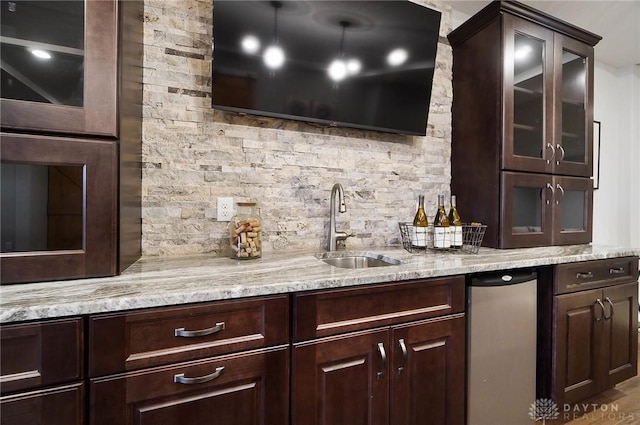 bar featuring indoor wet bar and a sink