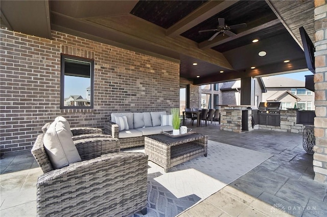 view of patio featuring an outdoor living space, area for grilling, ceiling fan, and a grill