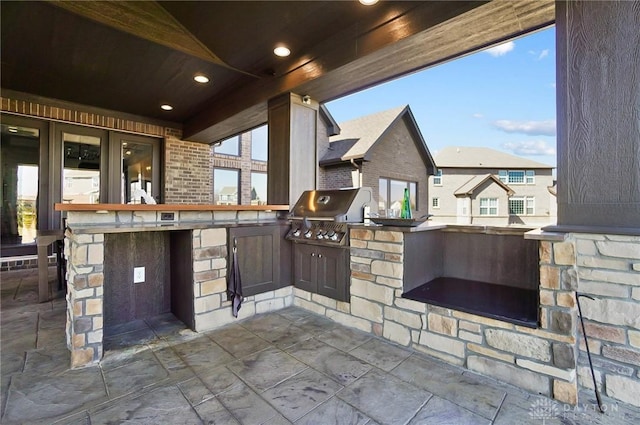 view of patio / terrace with an outdoor kitchen and a grill