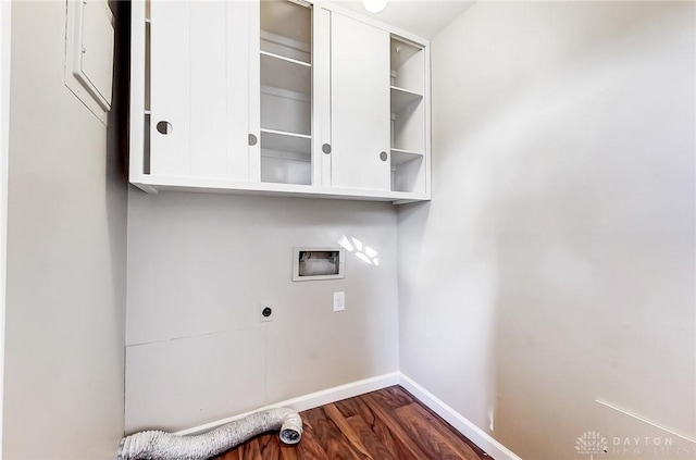 clothes washing area with baseboards, hookup for an electric dryer, cabinet space, washer hookup, and dark wood-type flooring