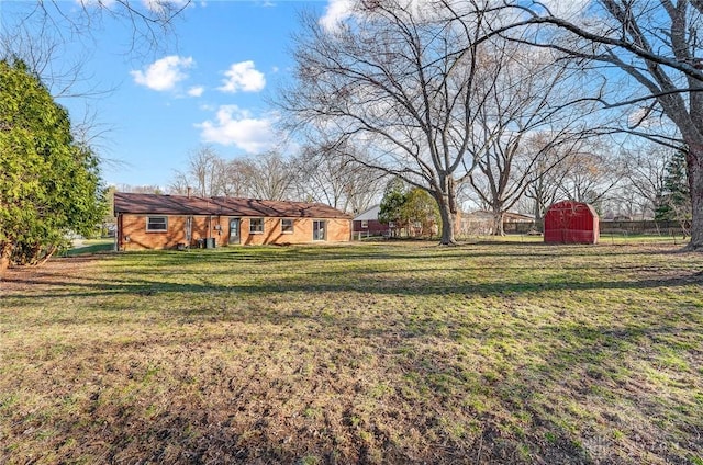 view of yard with a shed and an outdoor structure