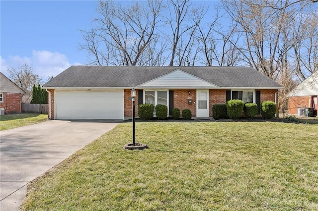 ranch-style house featuring a front yard, an attached garage, brick siding, and driveway