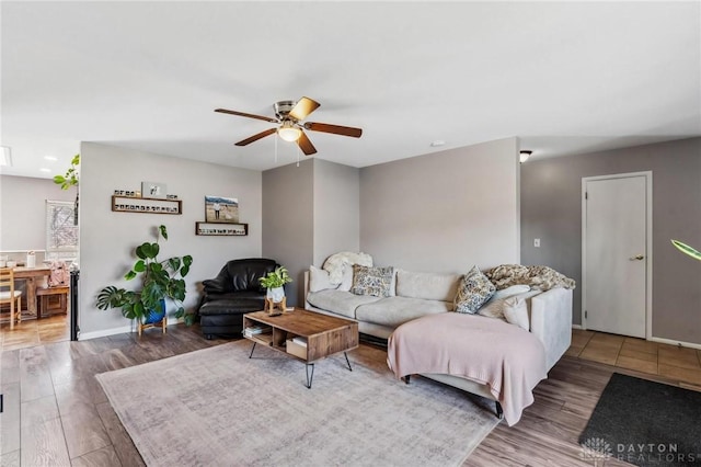 living area featuring a ceiling fan, recessed lighting, wood finished floors, and baseboards