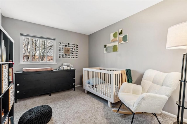 bedroom featuring carpet flooring and baseboards