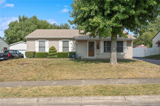 ranch-style home with a front yard