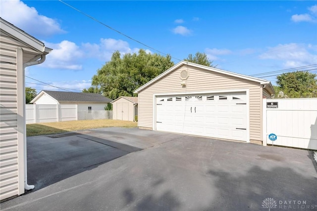 detached garage with fence