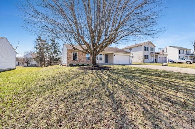 view of front of home with an attached garage, driveway, and a front yard