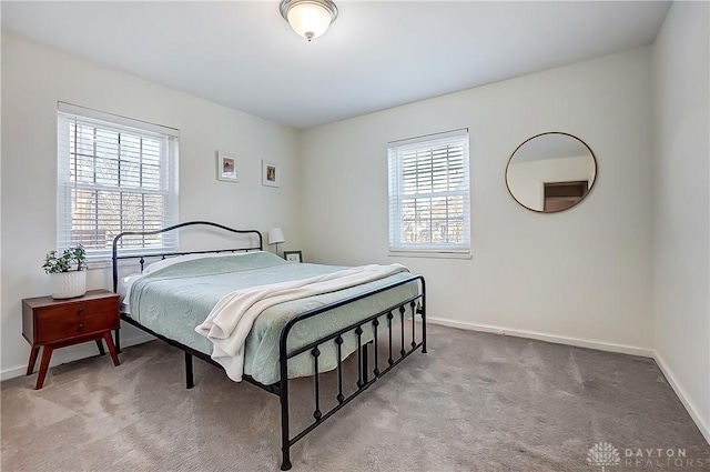 bedroom featuring baseboards and carpet floors