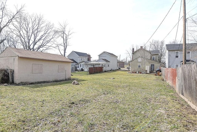 view of yard with a residential view and fence