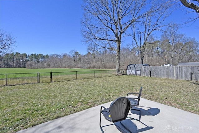 view of yard featuring a patio and a fenced backyard