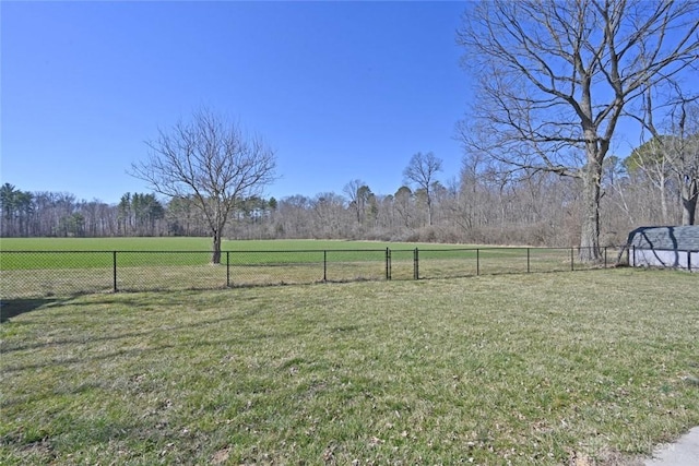 view of yard featuring a rural view and fence