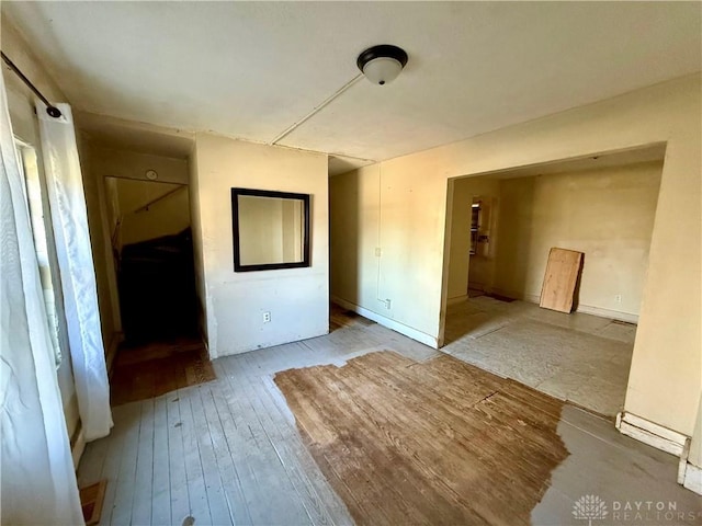 empty room featuring wood-type flooring