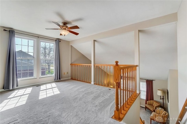 additional living space with ceiling fan, carpet flooring, and vaulted ceiling